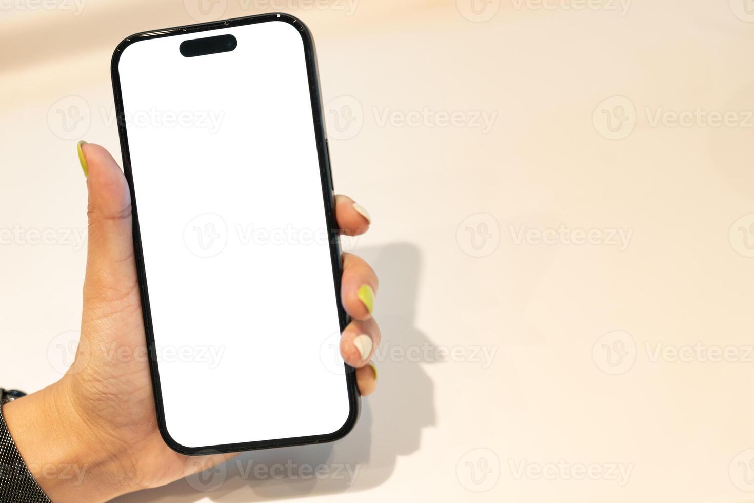White Screen Smartphone Mockup in Woman Hand. Ideal for mockups, app demonstrations, or showing digital content. Woman Shopping. copy space. photo