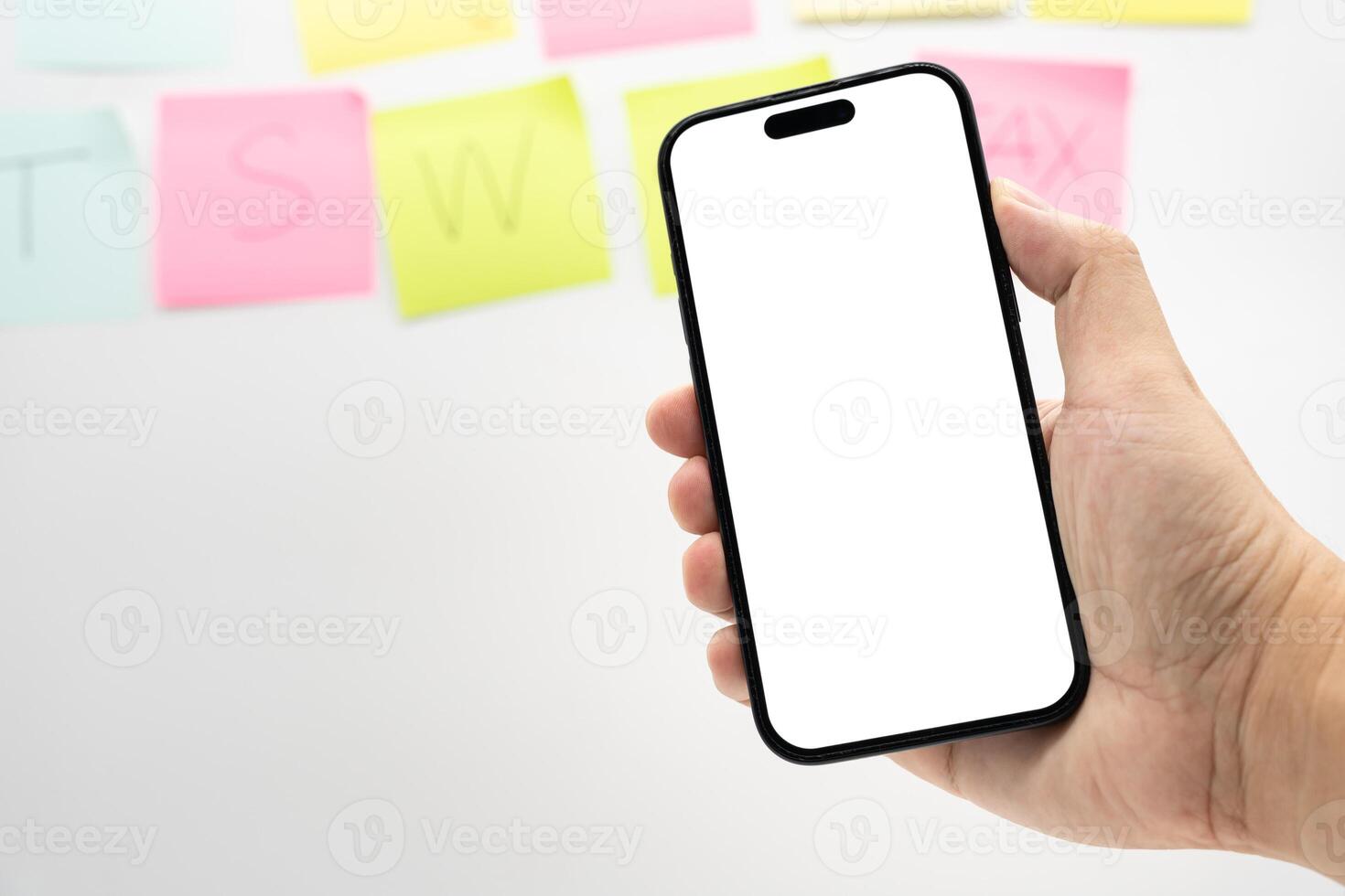 Hand Holding Smartphone with Blank Screen for Mockup and App Presentation. perfect for app presentation, UI UX design, advertising, and product mockup. Copy space. photo