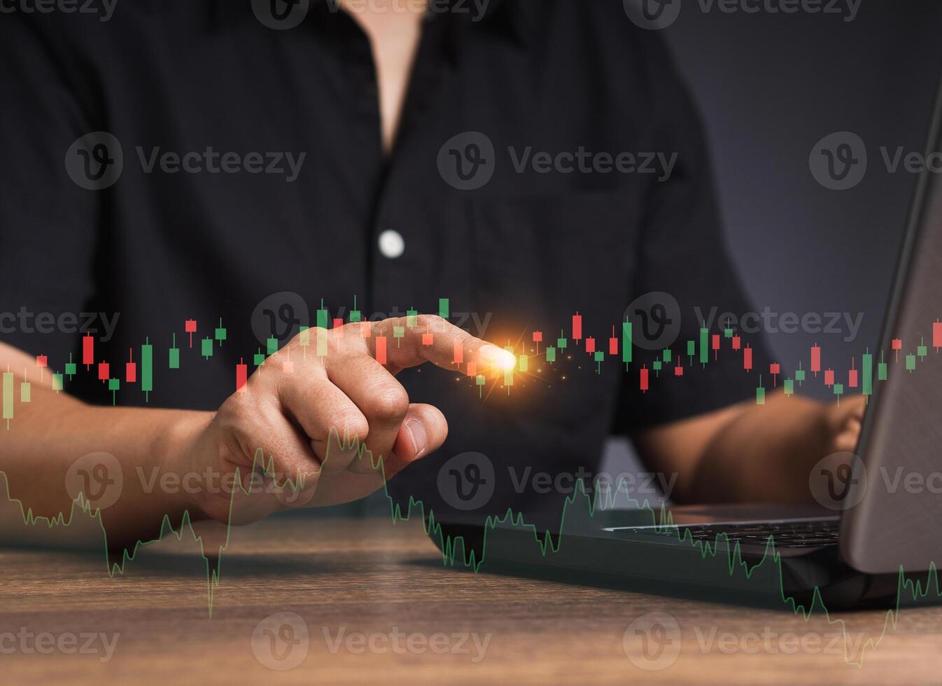 Stock exchange market analysis. A businessman or trader pointing to a graph stock on a virtual screen photo