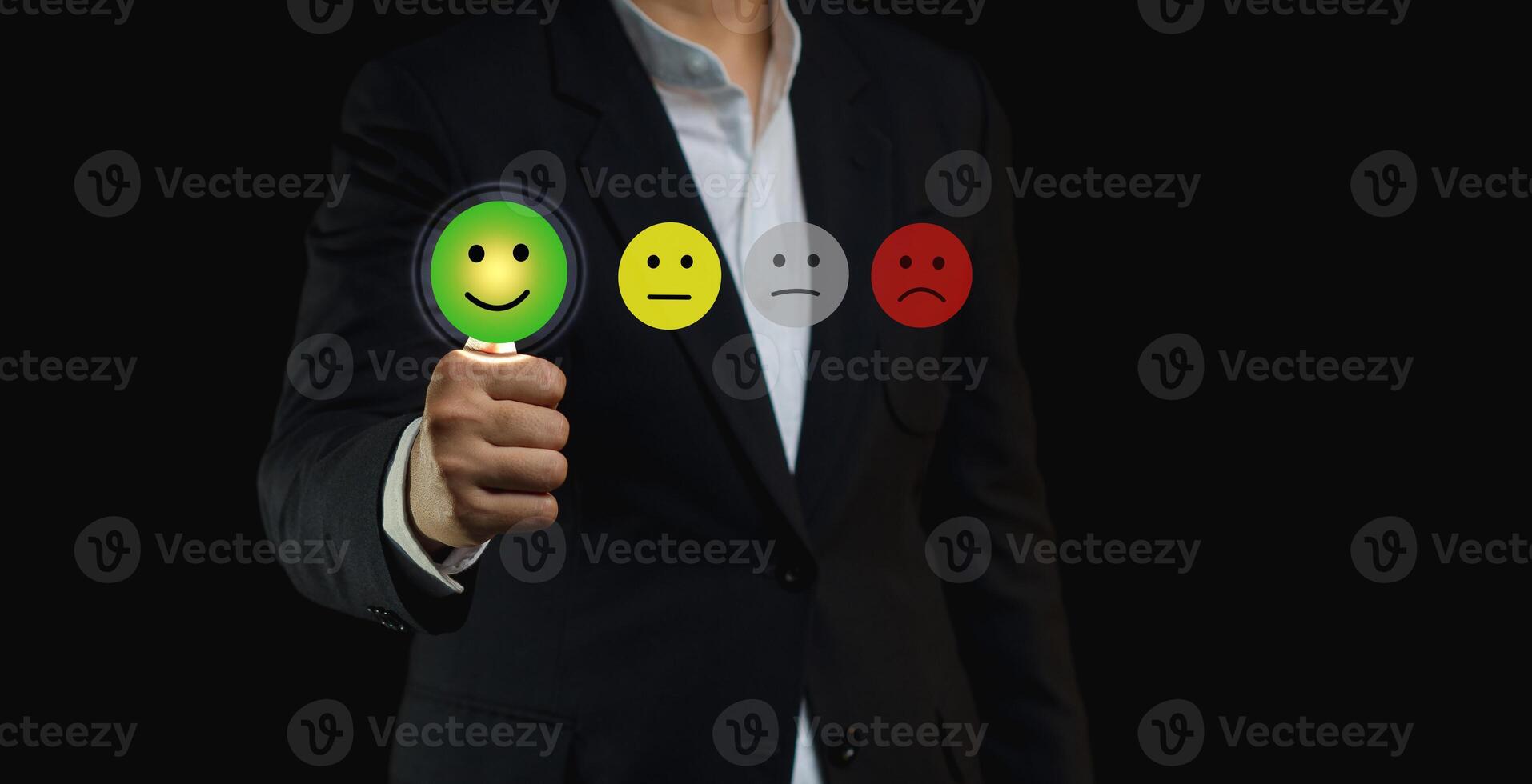 Choosing a green happy mood icon rating review in the survey of customer satisfaction on a virtual screen. photo