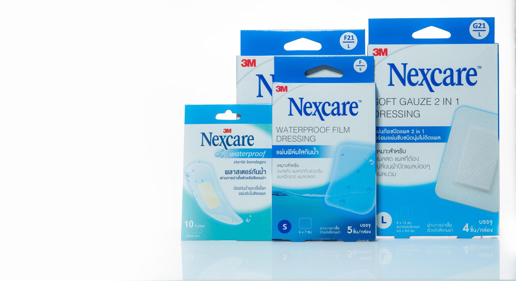 CHONBURI, THAILAND-JANUARY 30, 2023 3M Nexcare waterproof film dressing and gauze bandage boxes. Dual-layer wound care products. Home medicine kits and clinical first aid. Medical first aid supplies. photo