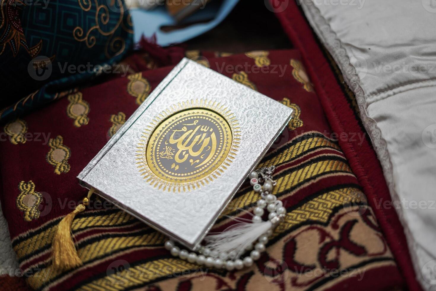 Holy Al Quran with written arabic calligraphy meaning of Al Quran photo