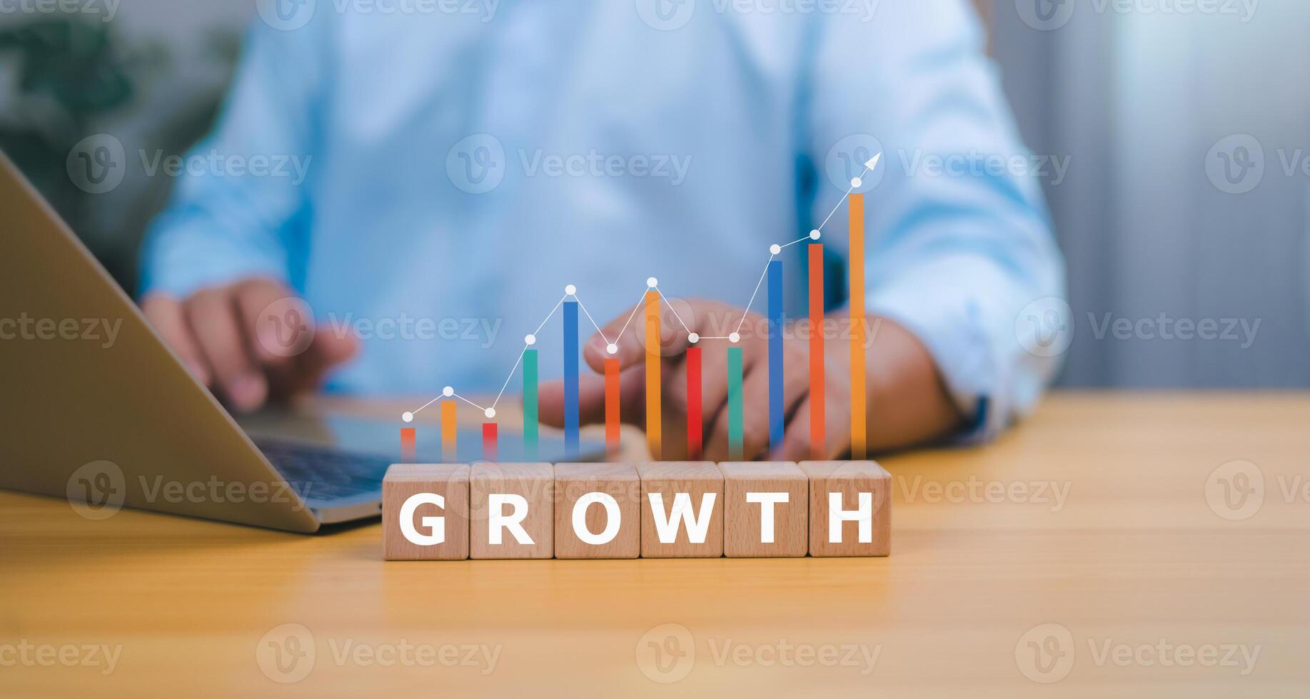 Business growth and financial success concept with person arranging growth cubes and glowing upward bar chart photo