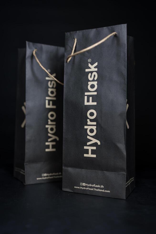 Bangkok, Thailand - July 6, 2025 Black paper bag from Hydro Flask package, environmental product. photo