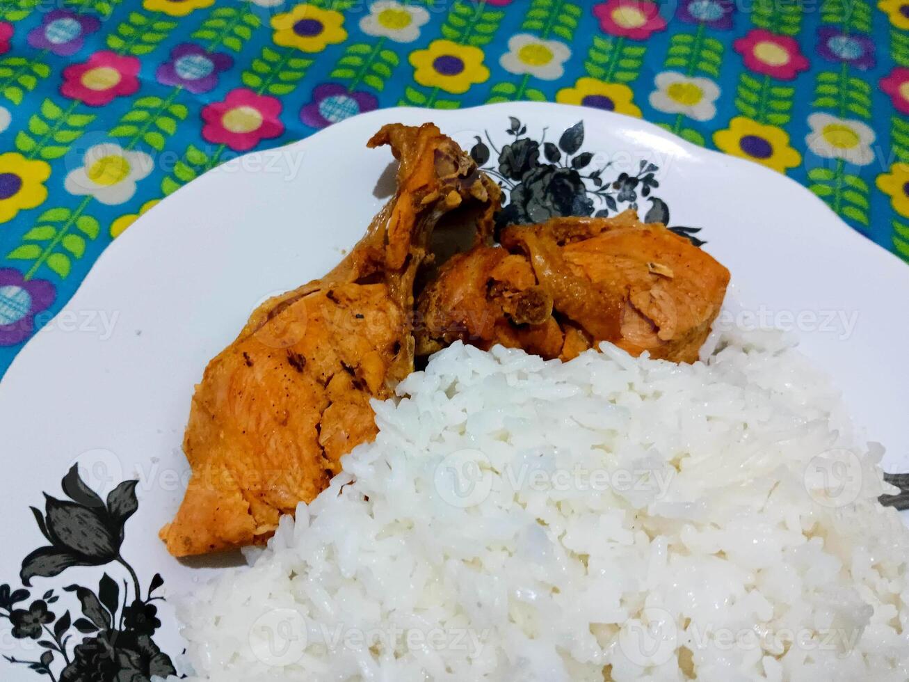 Crispy Chicken and Fluffy Rice on a Floral Plate photo