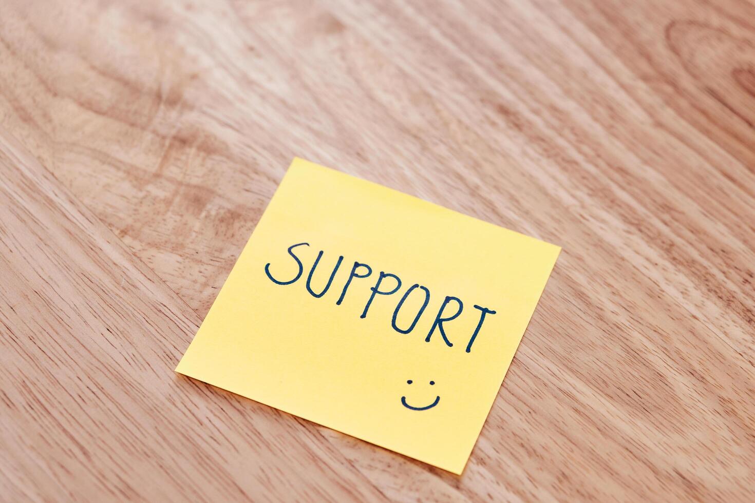 Supportive note yellow sticky pad office desk indoor close-up encouragement photo