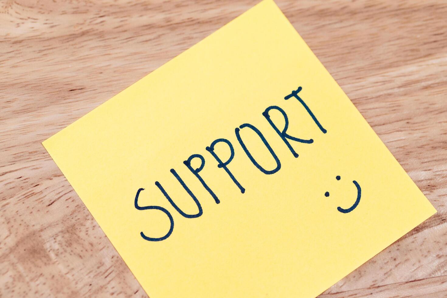 Supportive notes encourage positivity at work office desk indoor close-up conceptual photo