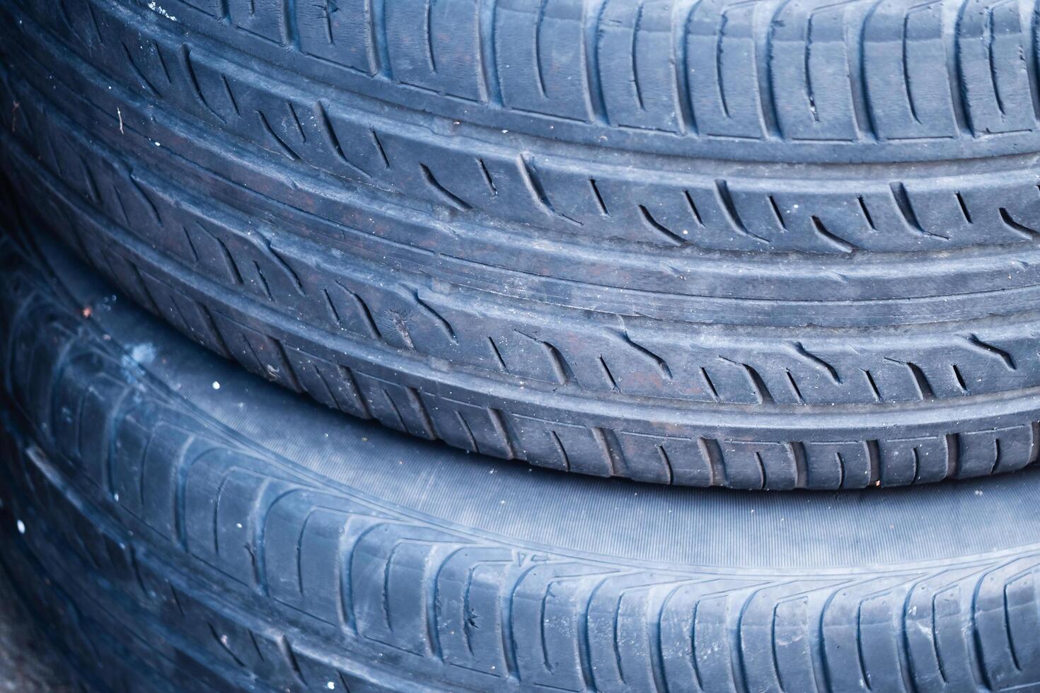 Inspecting used tires quality assessment at local garage automotive industry close-up practical insight photo