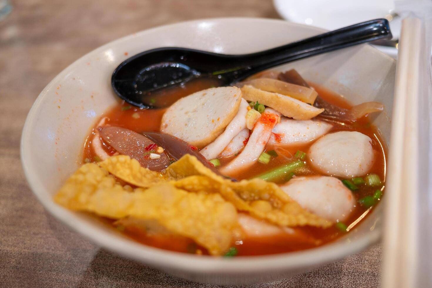 Delicious spicy noodle soup preparing event local eatery food cozy setting close-up view photo