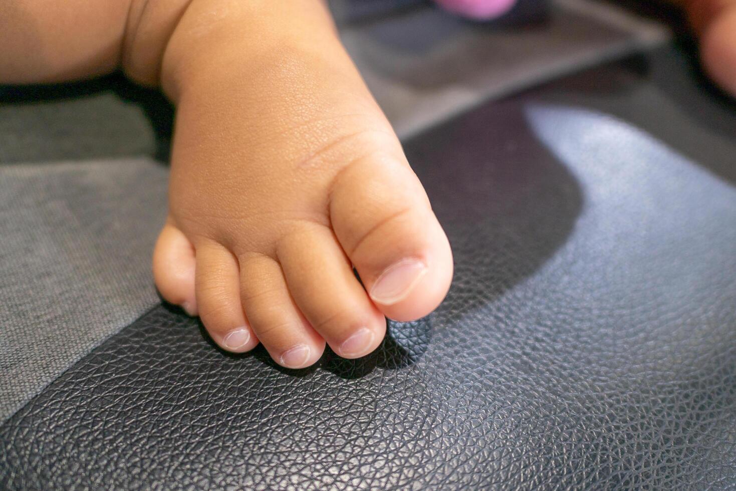 Baby's tiny footprints home baby cozy indoor setting close-up perspective childhood memories photo