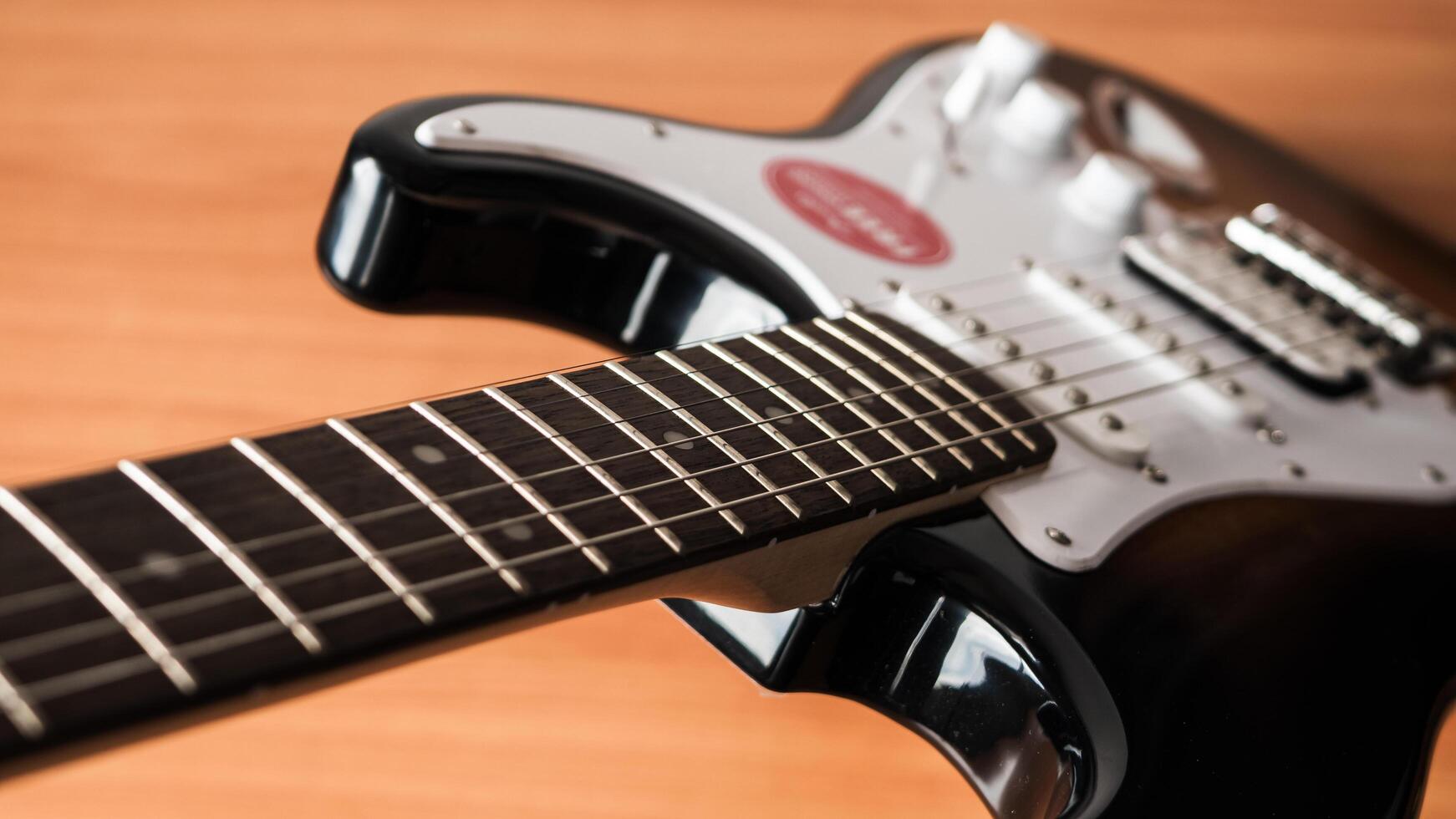 Captivating electric guitar close-up home studio warm lighting artistic perspective photo