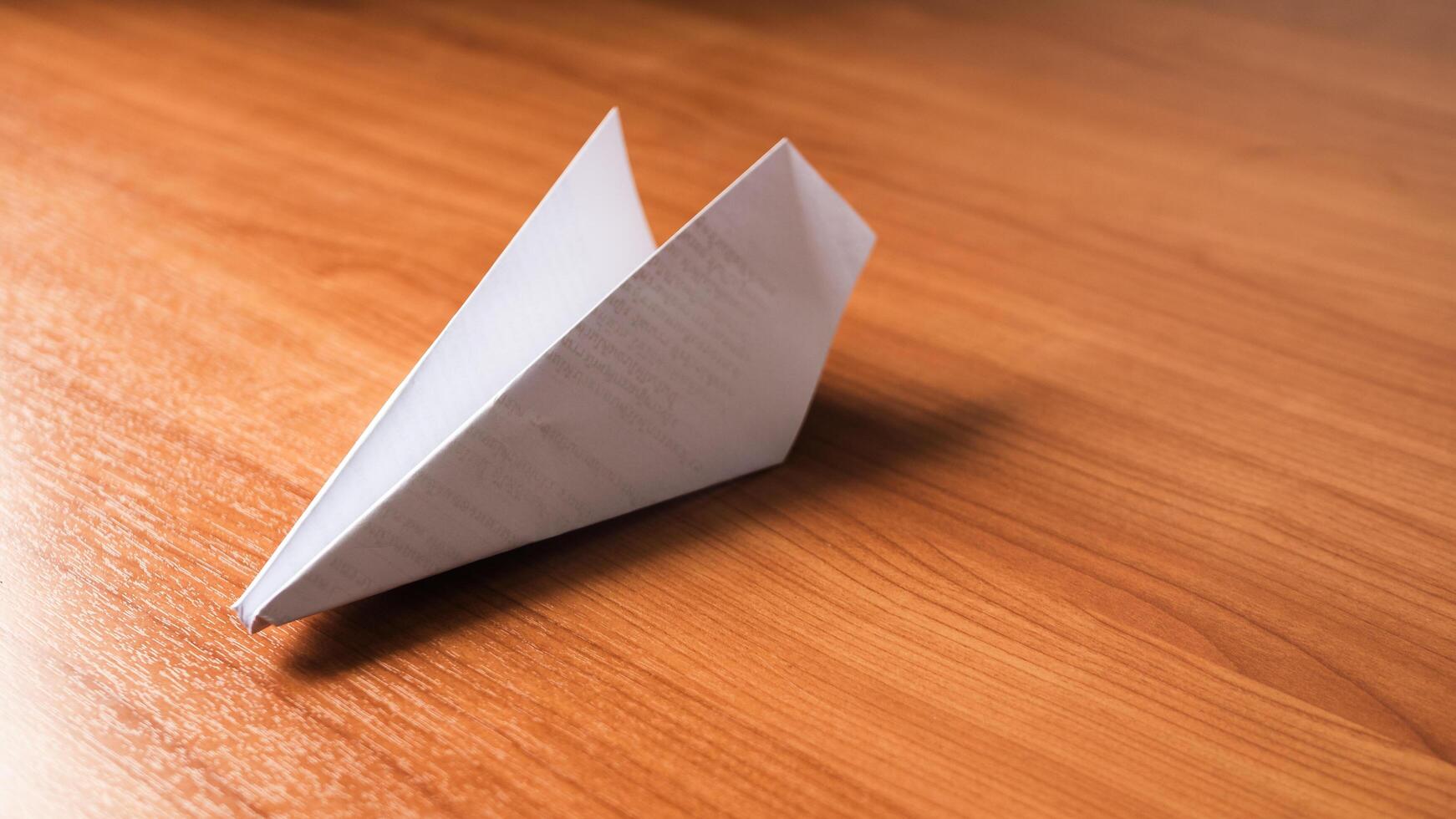 Creative paper airplane launch home office diy project indoor close-up fun learning experience photo