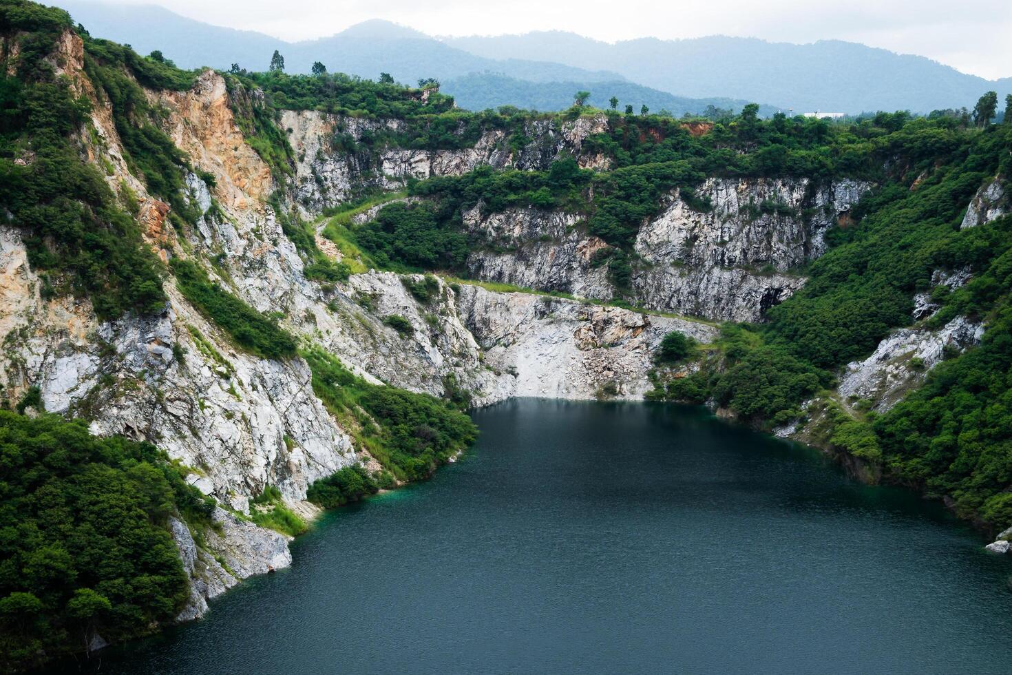 Stunning view of a serene lake amidst rocky mountains nature tranquil environment aerial perspective photo