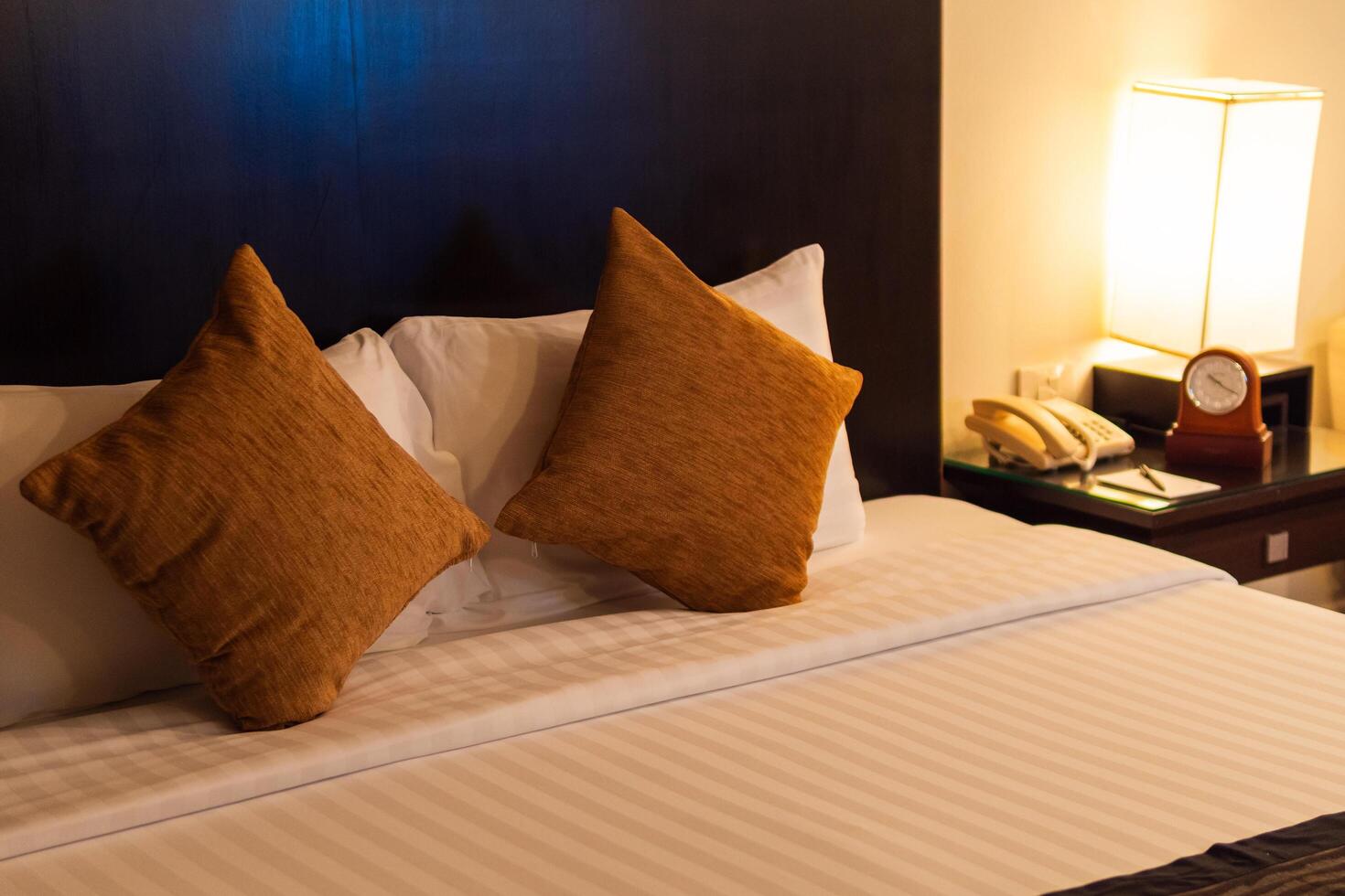 Cozy hotel room with stylish decor city center interior design warm atmosphere eye-level view comfort concept photo