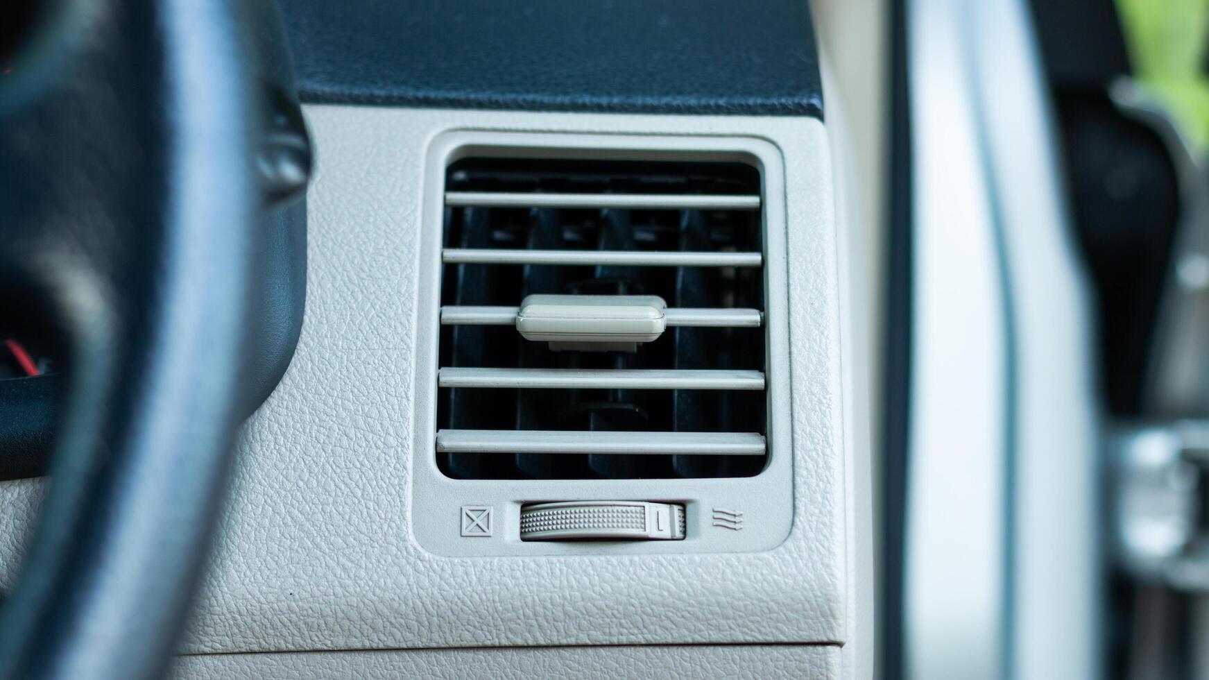 Vehicle interior focus overview of car air conditioning vent system and airflow concept photo