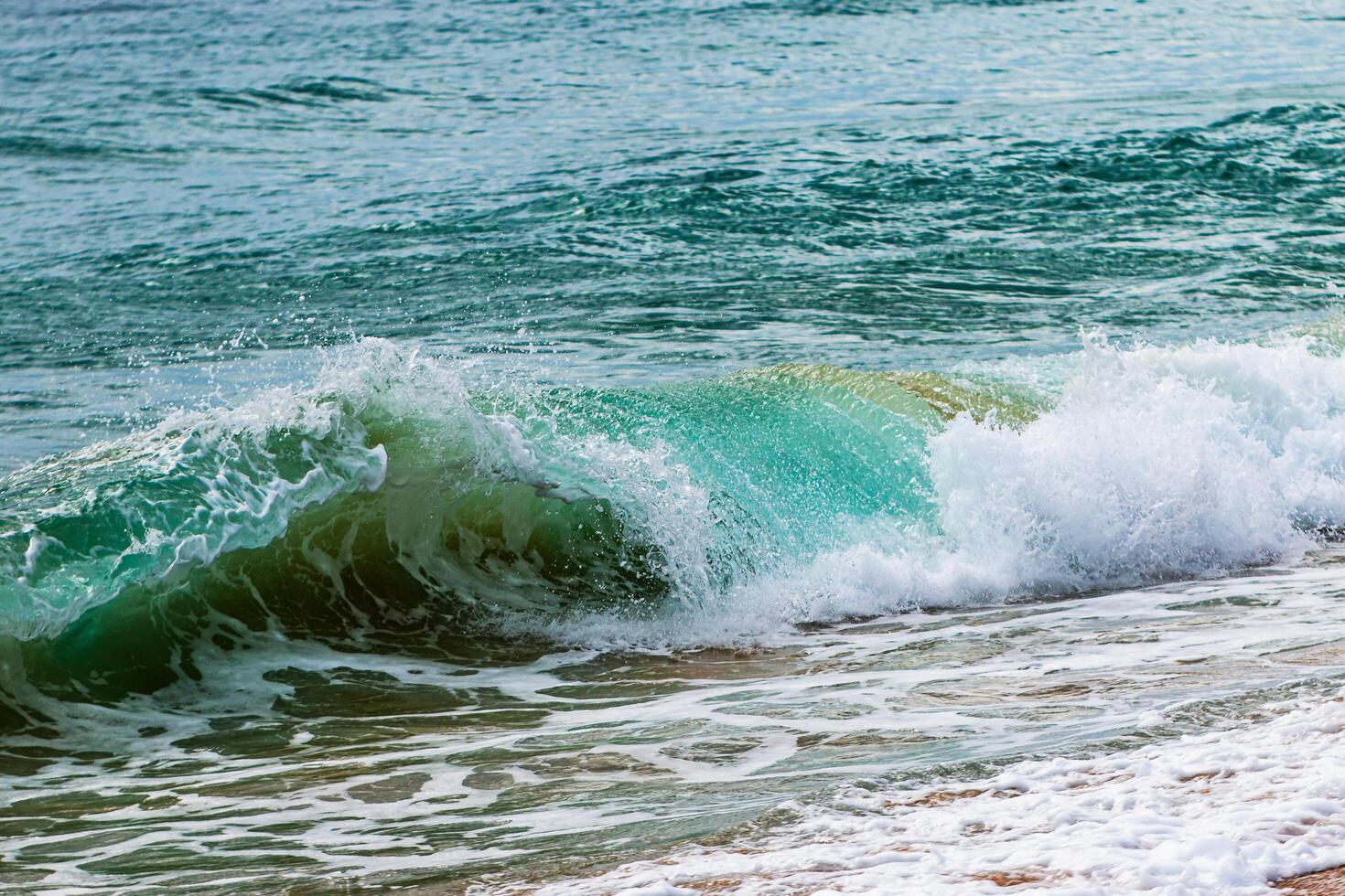 Waves crashing shore beach nature coastal environment close-up view serenity concept photo