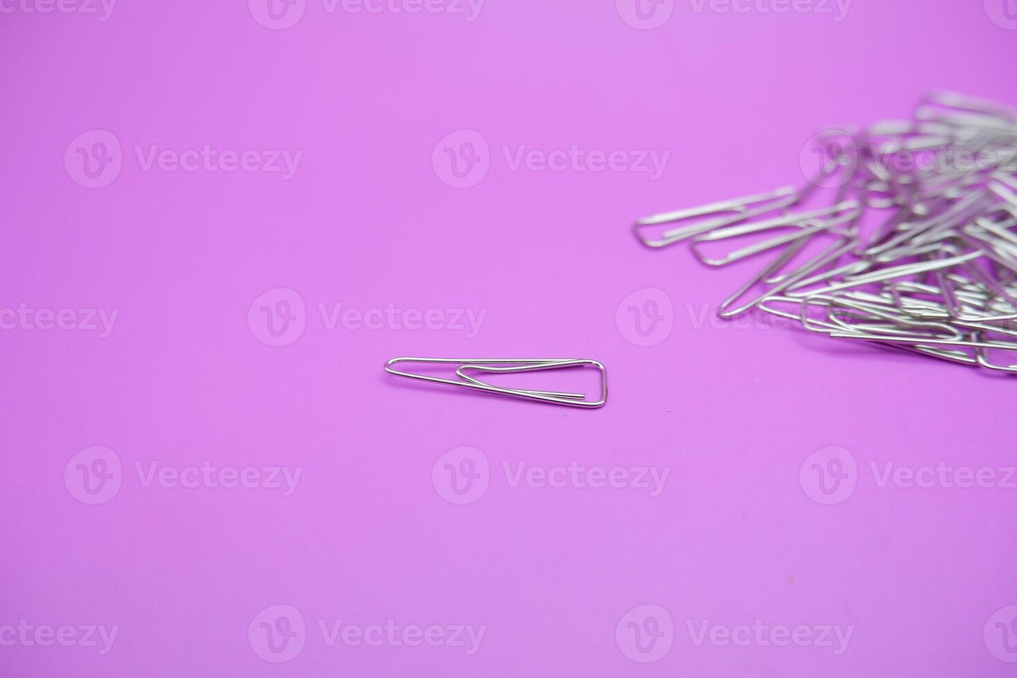Unique Shaped Paper Clips in a Pile photo