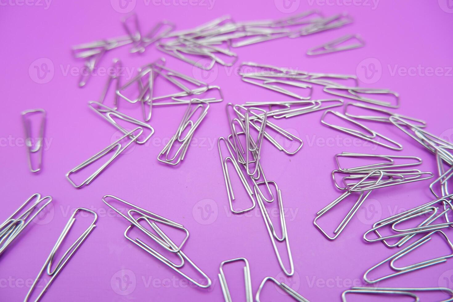Cluster of Metal Triangle Paper Clips for Documents photo