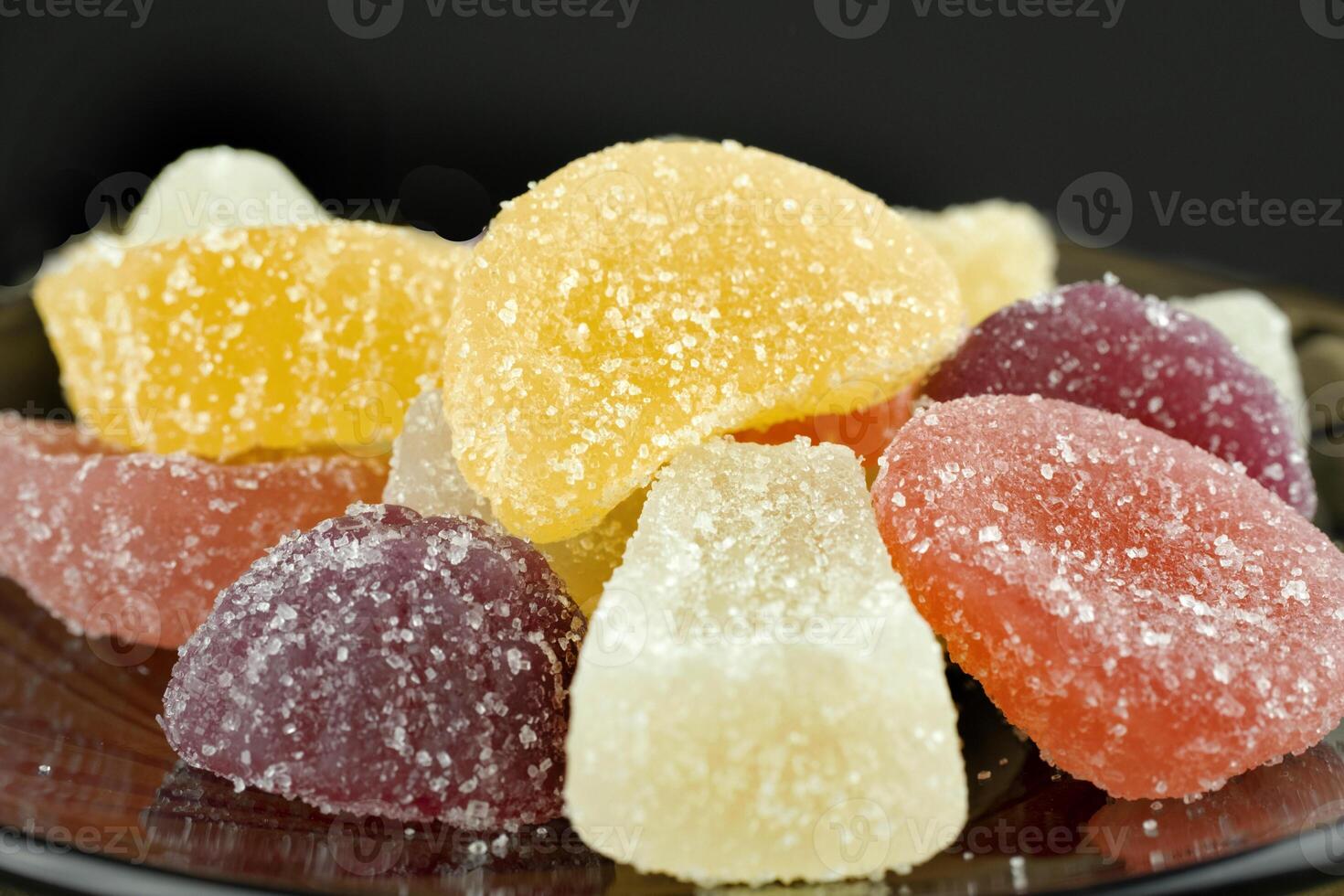 Multi-colored, marmalade candies, close-up, isolated on a black background. photo