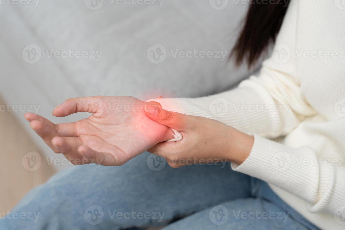 woman work in office with a carpal tunnel syndrome or wrist joint inflammation, hand muscle inflammation from office syndrome , hand muscle pain from work photo