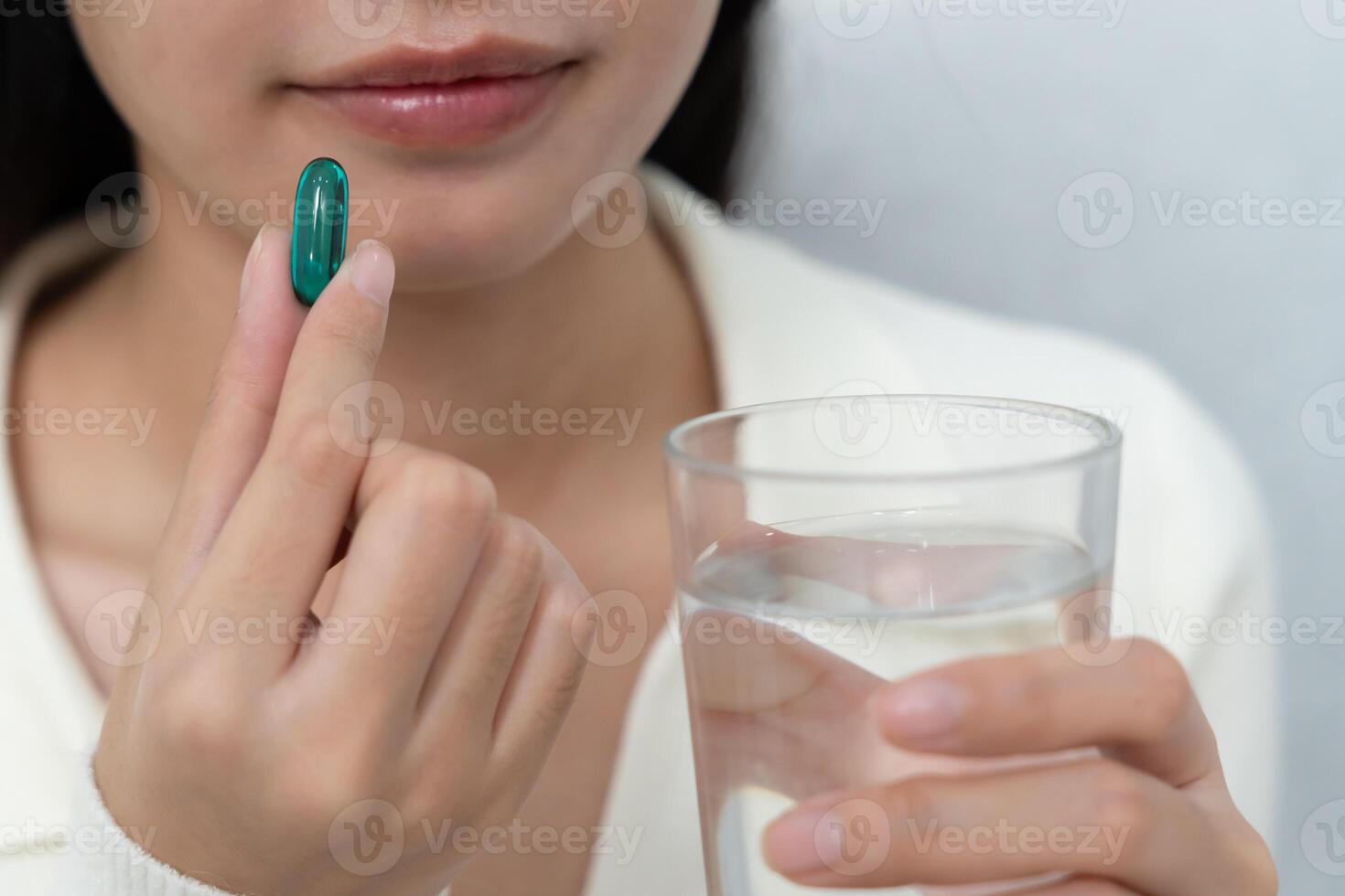 girl hold medicine and take medicine, pain, cure disease, sterilize, take vitamin, sedative, health care, Dietary supplement, medicine for medical treatment, tonic, daily dosage of medication photo