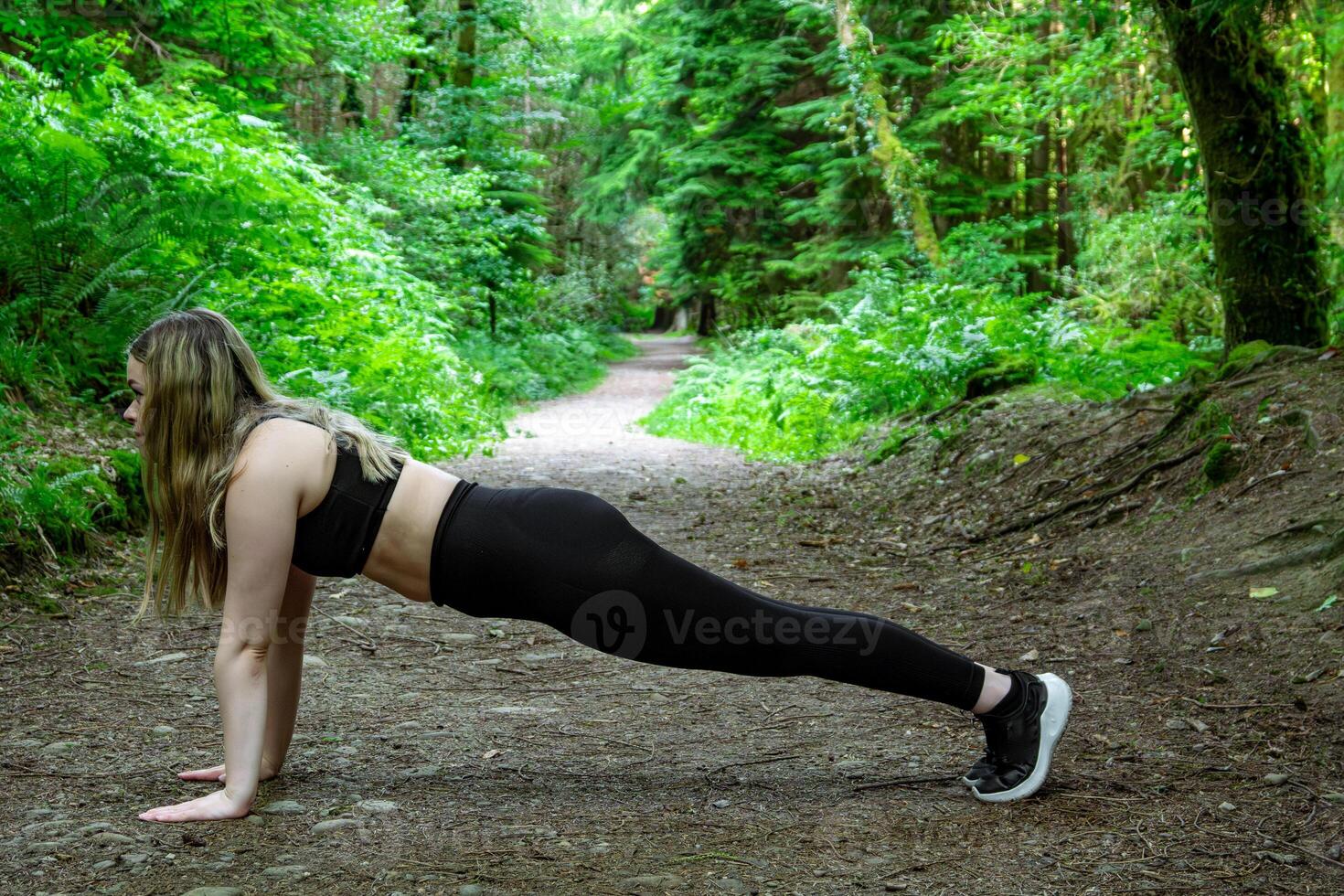 Fitness in Nature Engaging in an Outdoor Plank Exercise for Building Strength and Endurance photo