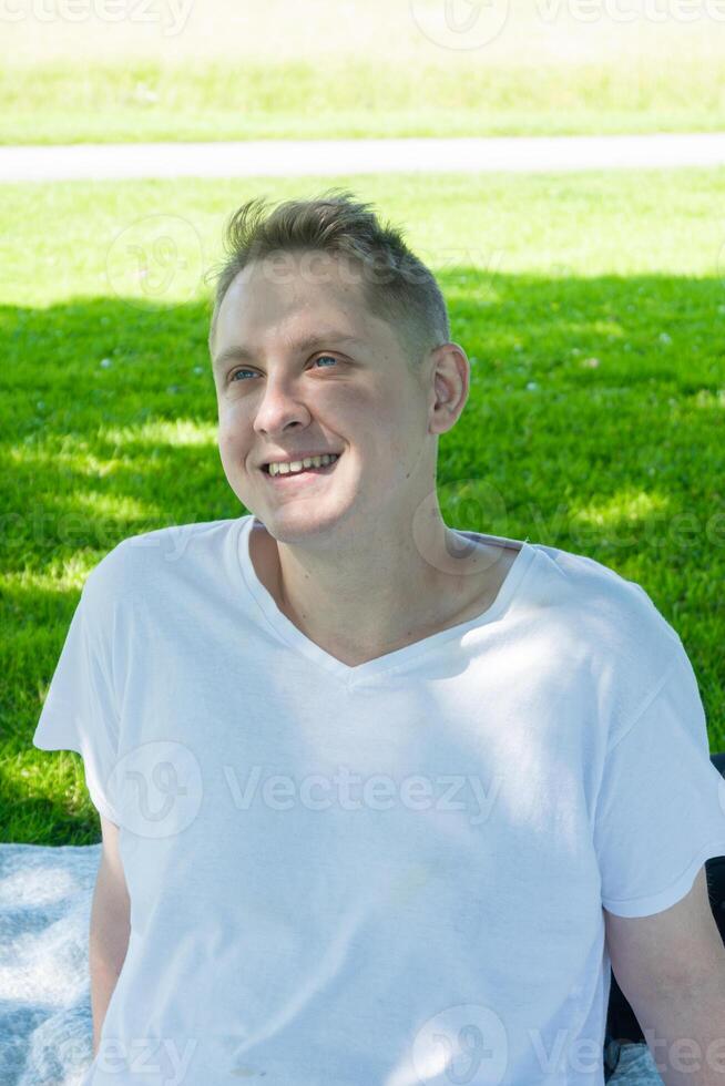 A Person With a Big Smile Enjoying a Beautiful Sunny Day in the Lovely Park Outside photo