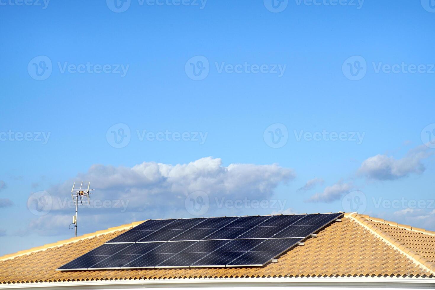 Renewable energy, solar panels on the roof of a house photo