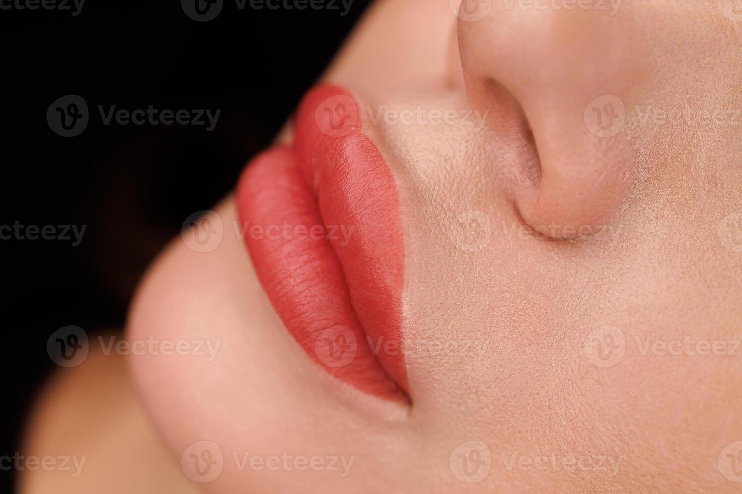 Well-executed PMU on lips with sharp lines and even coloring, ideal skin finish. photo