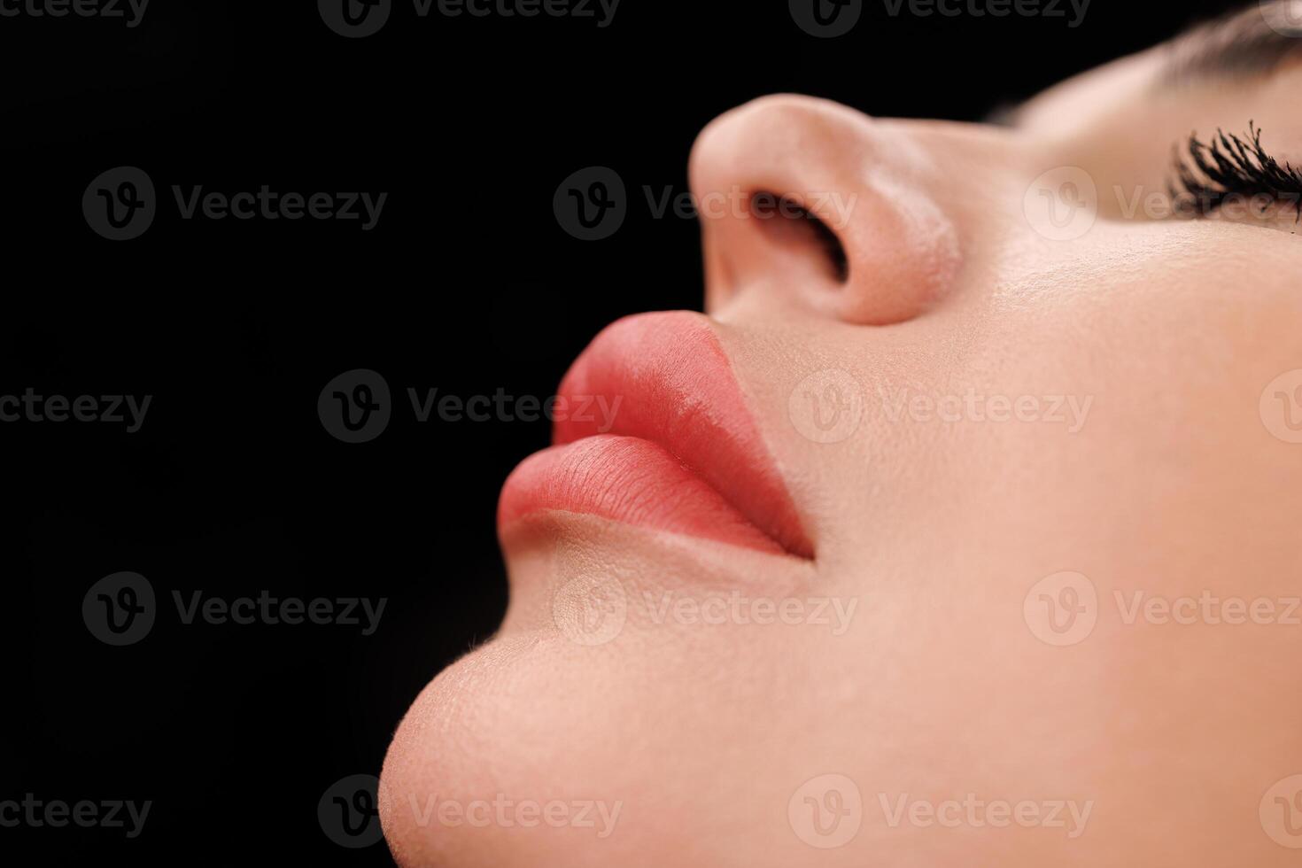 Focus on lips with refined shape and pigmentation after expert permanent makeup. photo