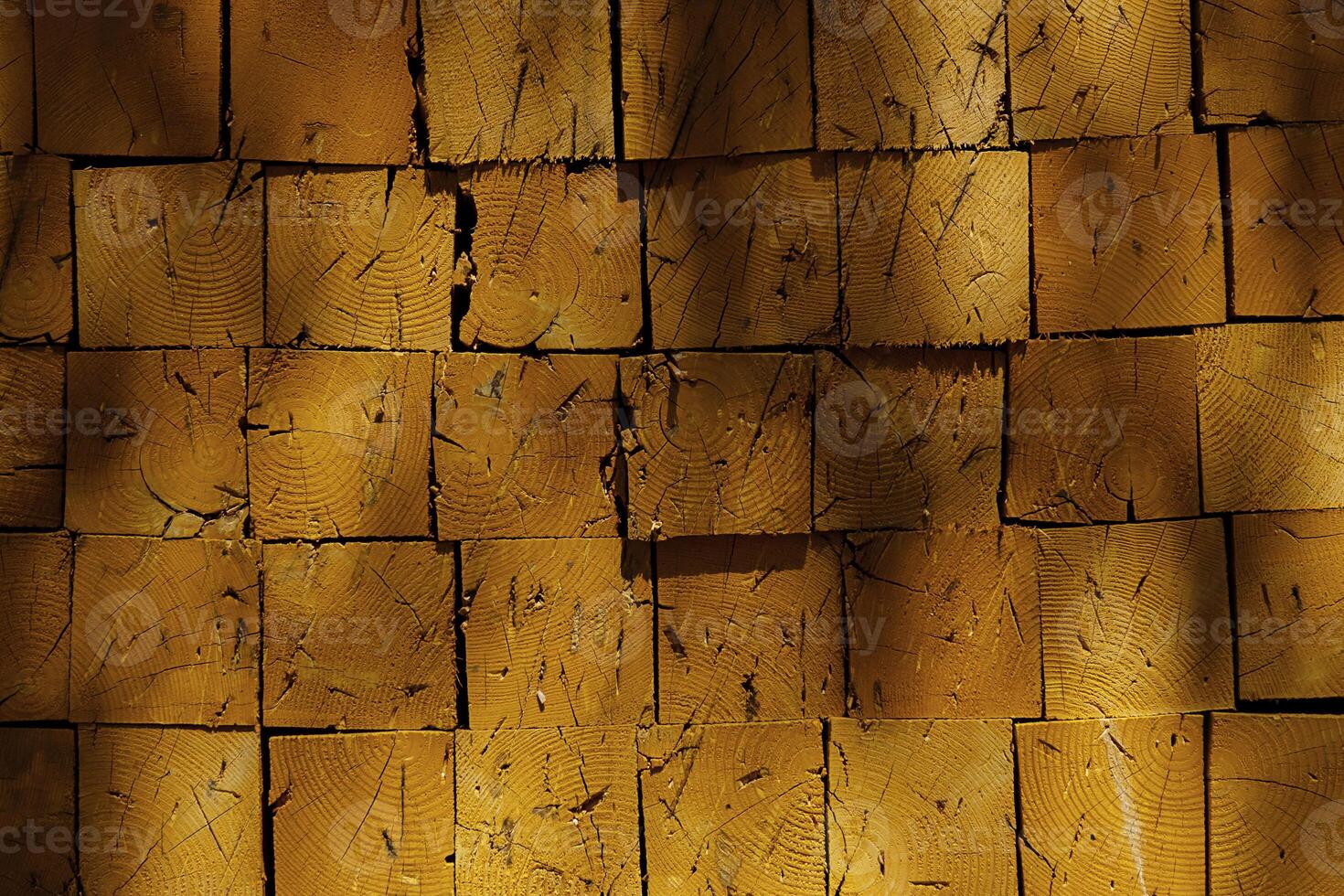 Stack of cut logs forming solid wall, timber abstract texture backdrop. Concept for wood material industry or natural resource. photo