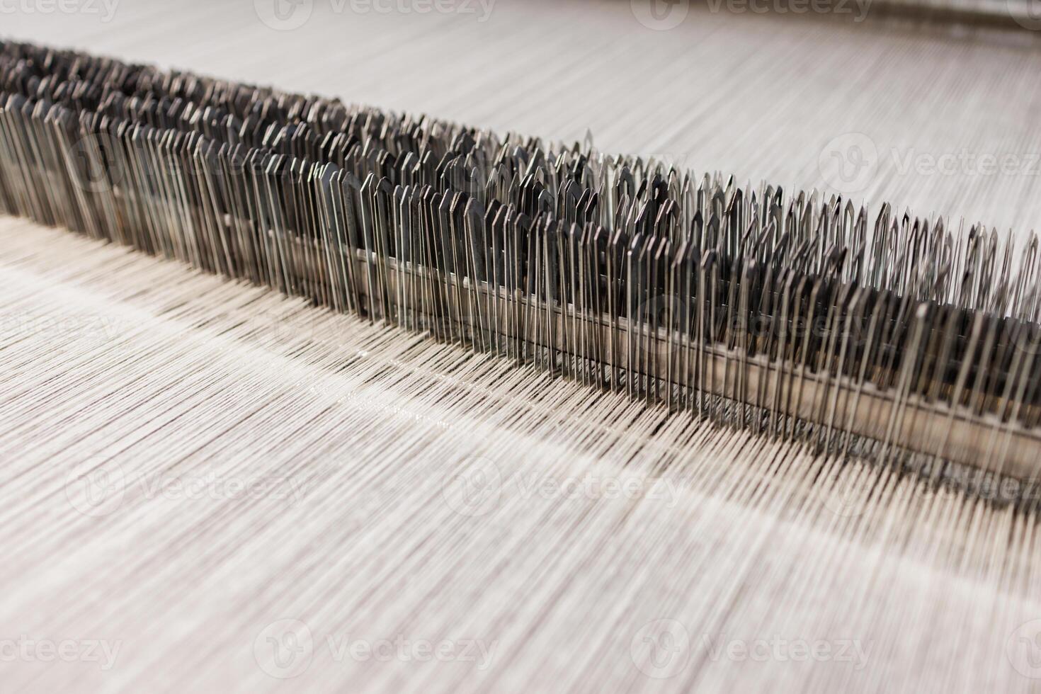 Closeup of Factory Loom Mechanism in Wool Fabric Production Industrial Textile Manufacturing Process photo