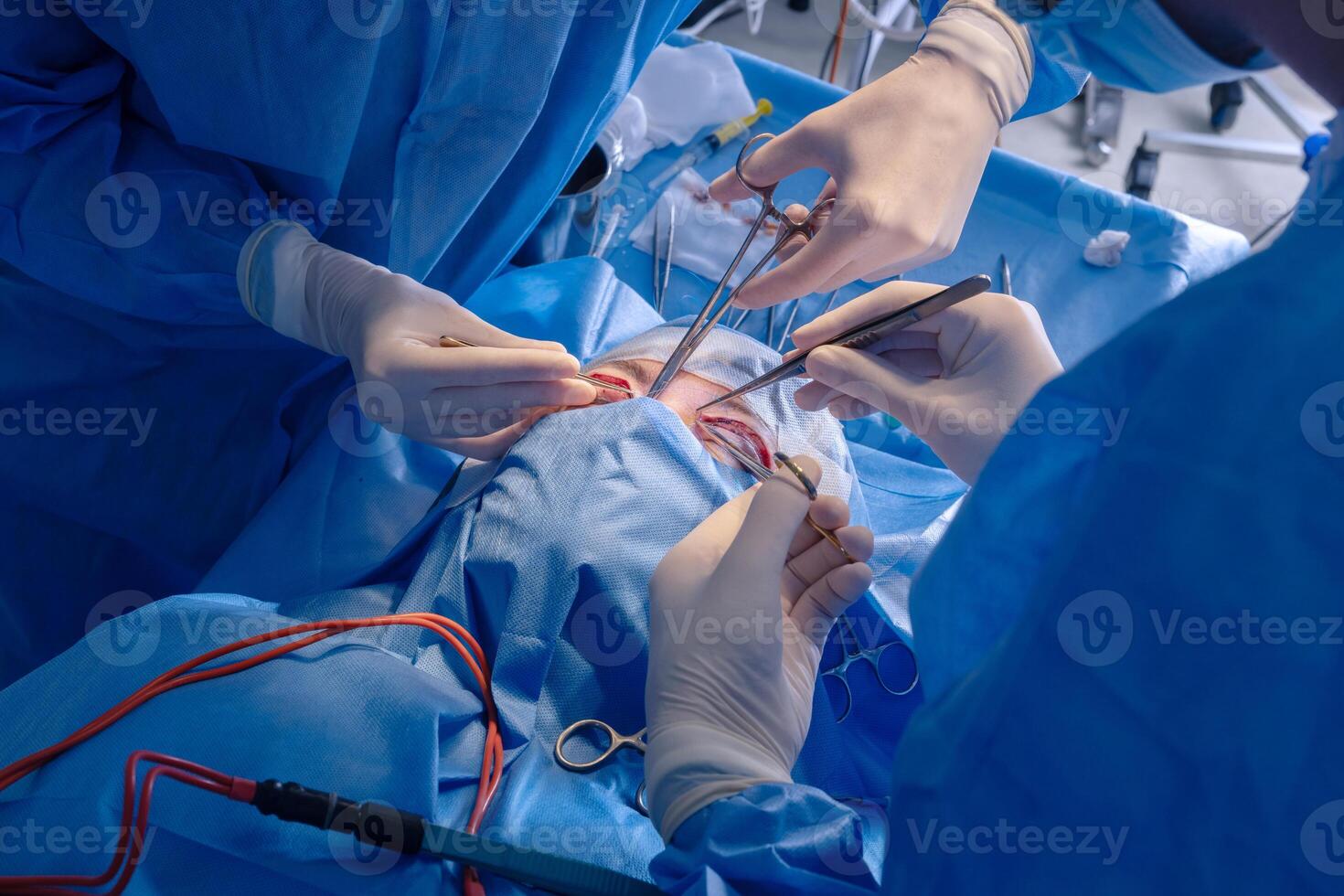 Surgeons performing a surgical procedure photo