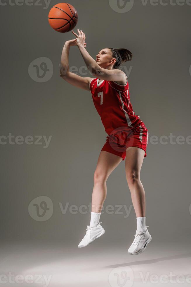 female basketball player shooting ball photo