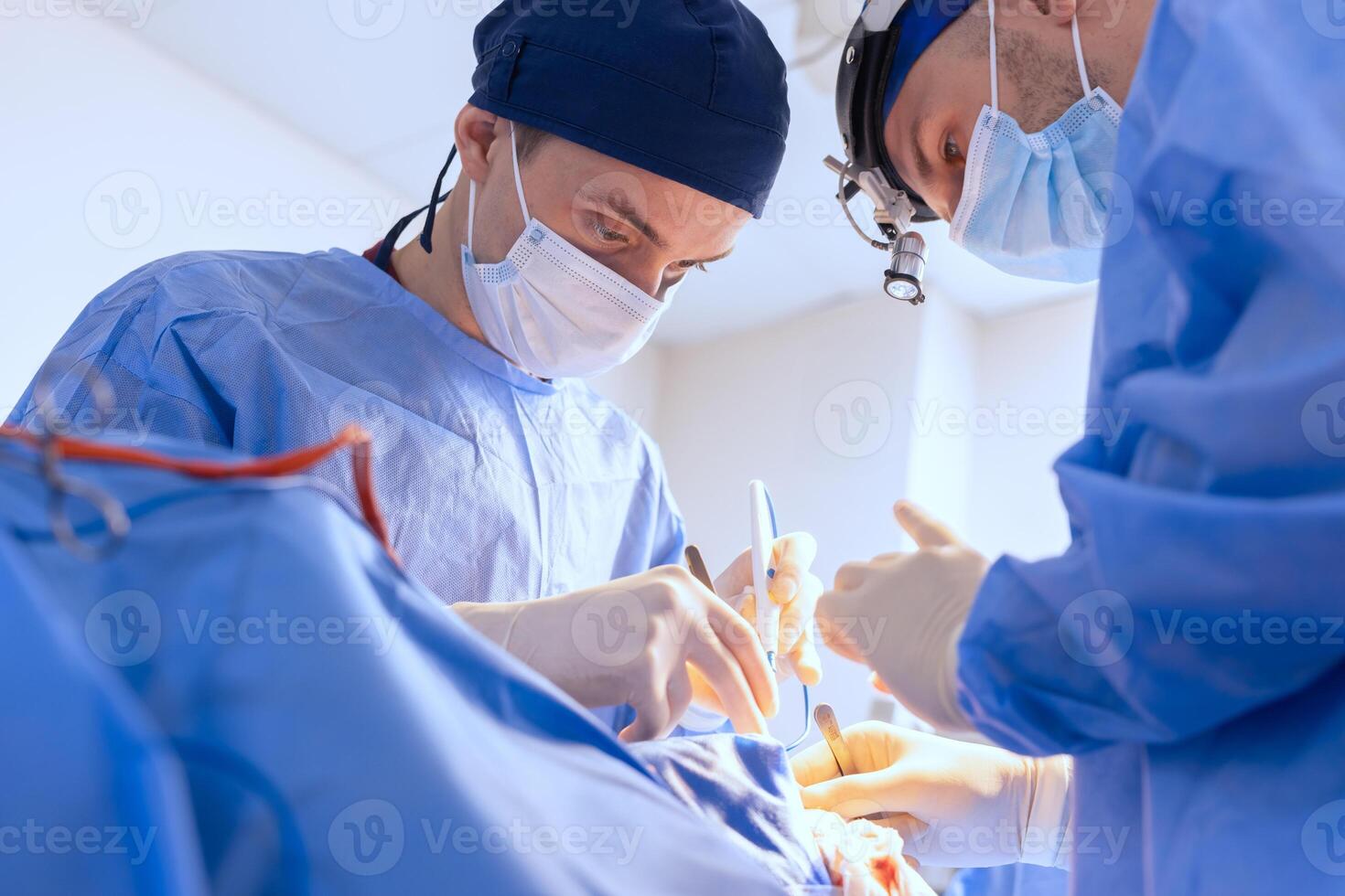 Blepharoplasty Surgery Performed by Surgeons in Modern Clinic Operating Room with Professional Equipment photo