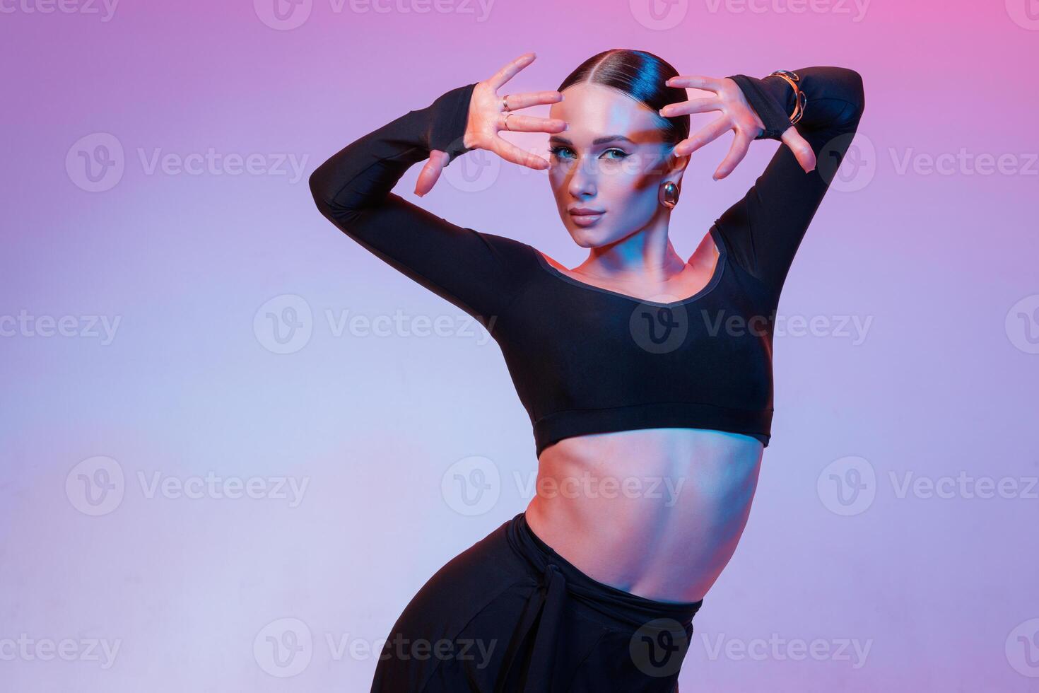 Latin Female Dancer Portrait in Studio with Expressive Hand Pose Modern Fashion Dance Close Up photo
