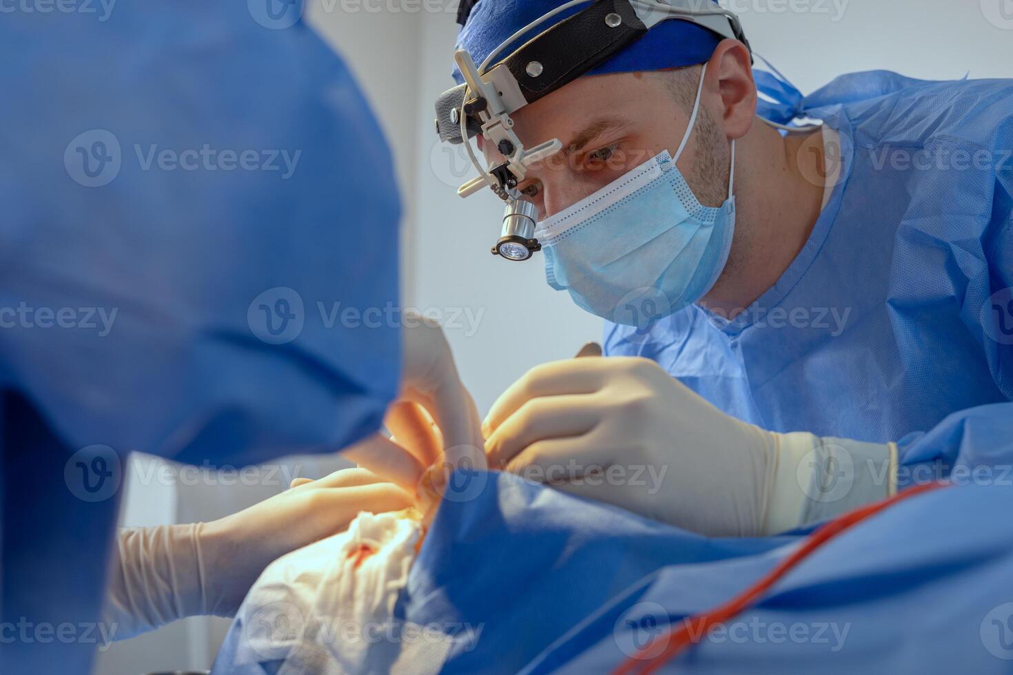 Blepharoplasty Eyelid Surgery Performed by Surgeon in Modern Operating Room During Medical Procedure photo