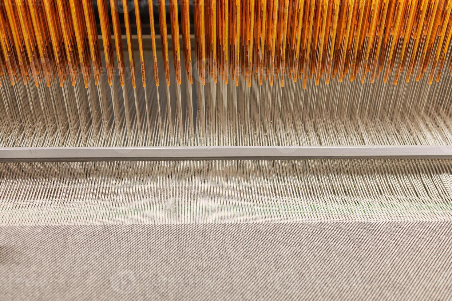 Closeup of Factory Loom in Wool Fabric Production Industrial Weaving Machine and Textile Manufacturing photo