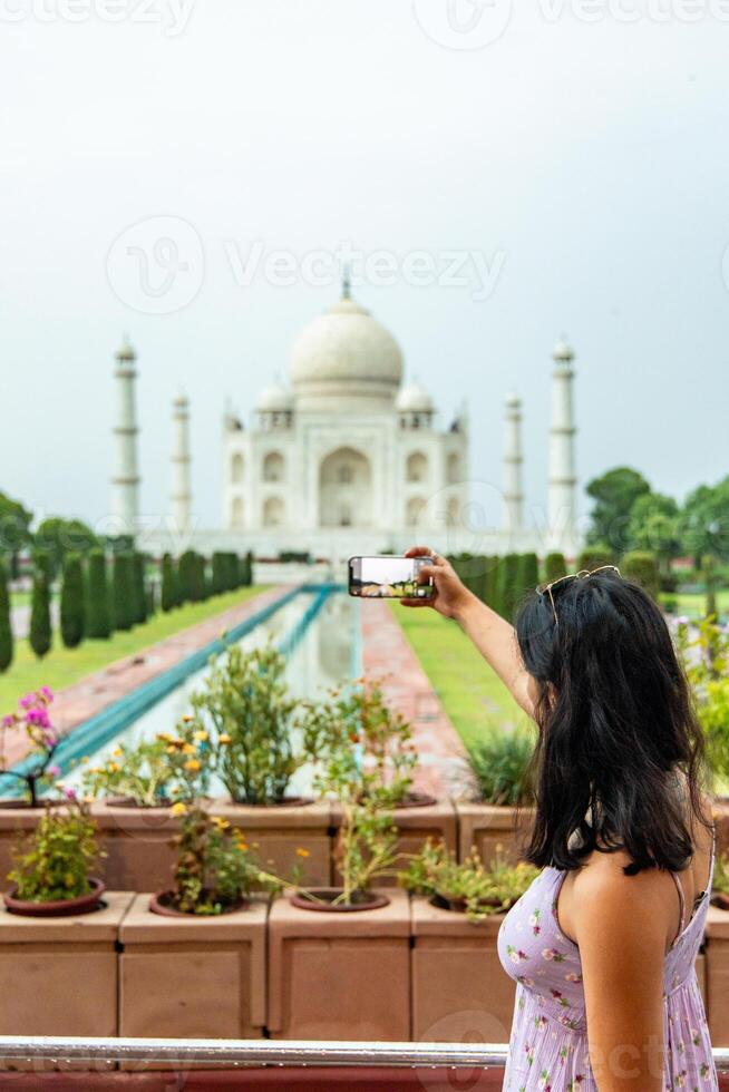 Tourist taking photo of Taj Mahal in Agra