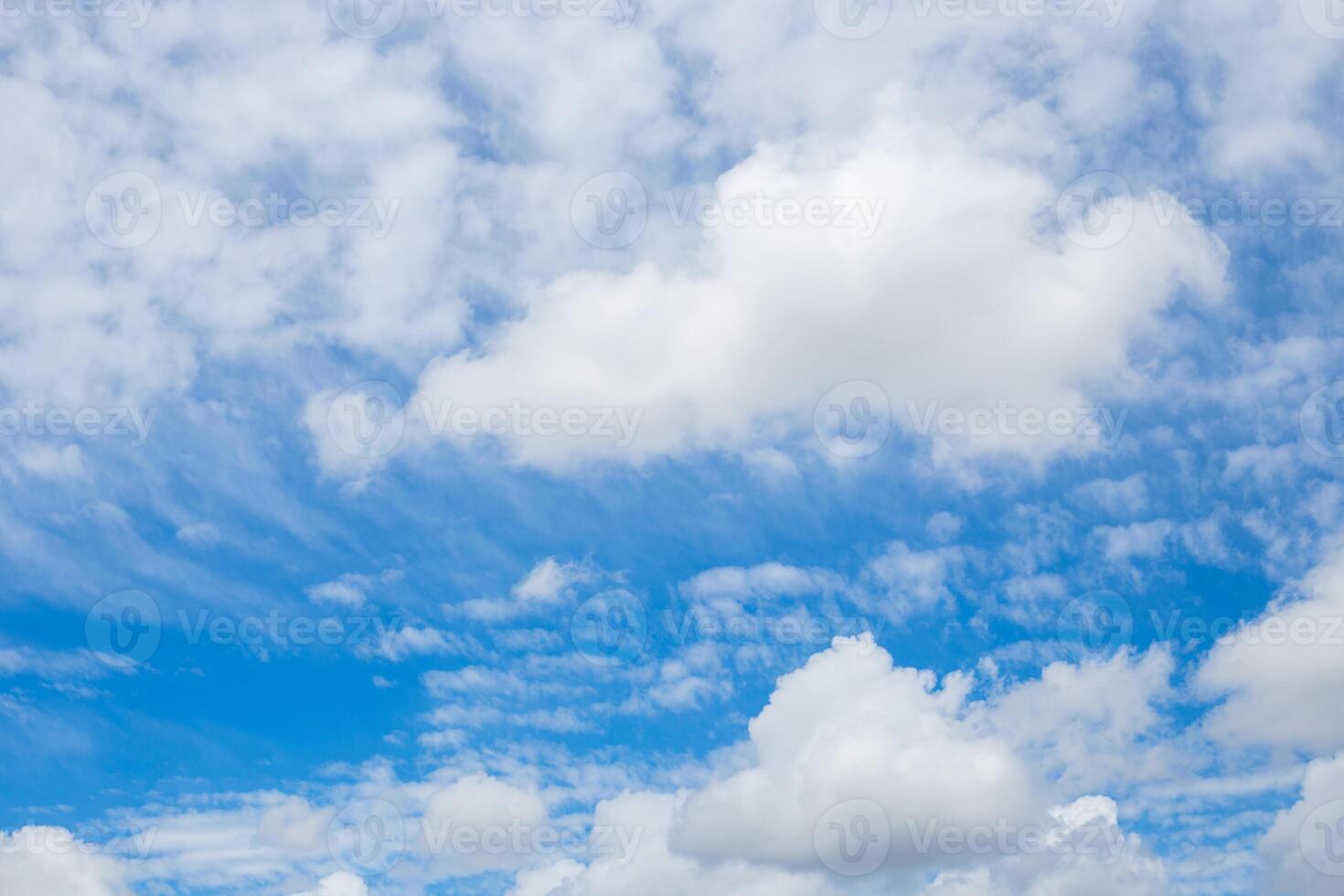 Sky with fluffy white clouds, airy atmosphere. Skyscape, background. photo