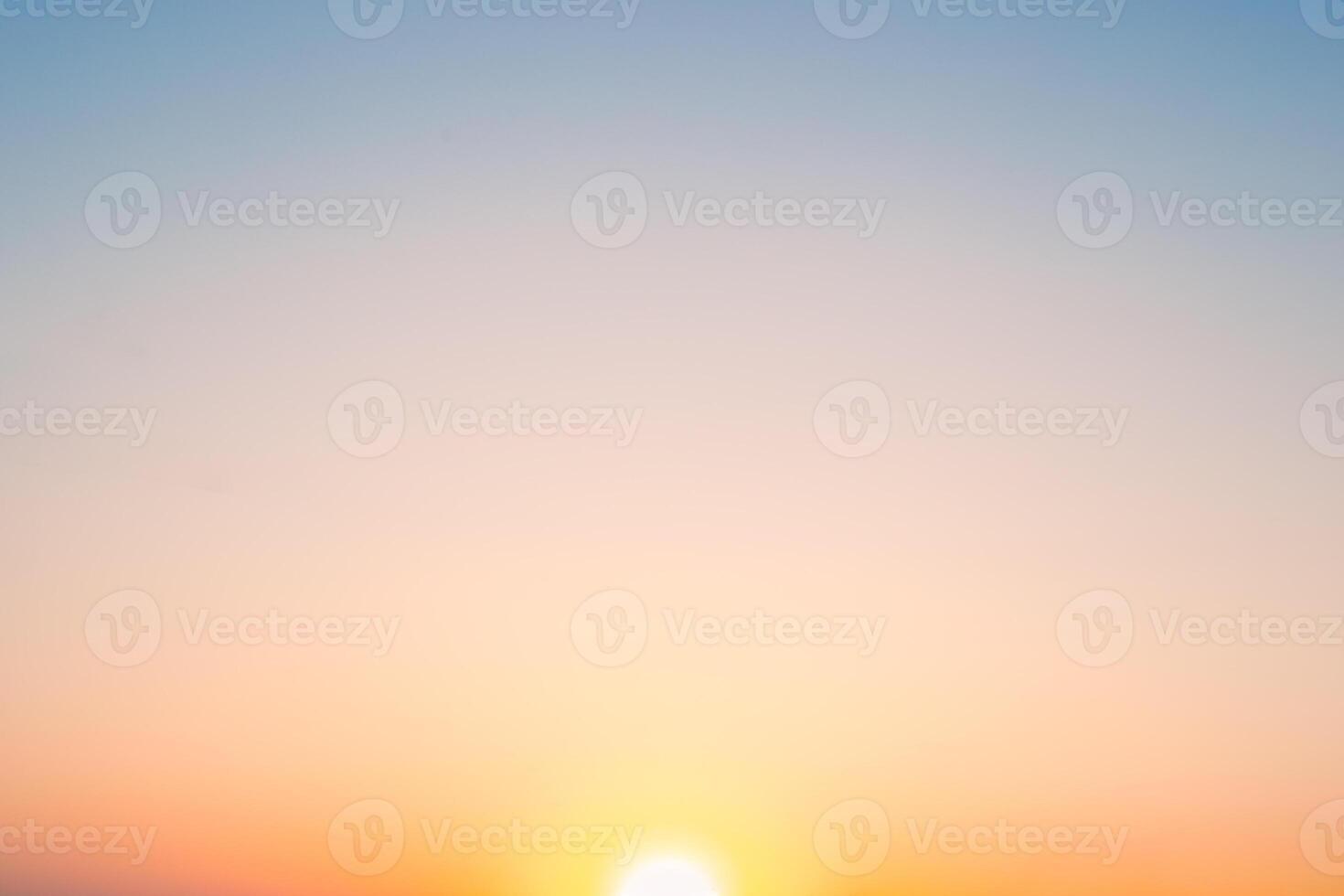 The sunset sky gradient transitions from deep orange to soft blue, capturing a moment of natural beauty photo