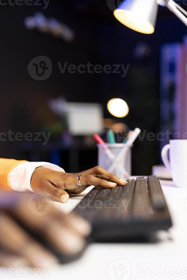 Teleworker working from home, typing on computer keyboard, writing in document. Remote employee pressing keys on PC keyboard, sending emails to business partners, close up photo