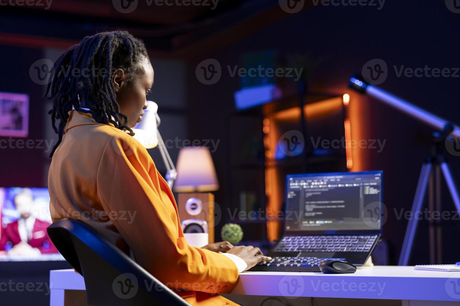 Freelancing admin in home office using laptop to write programming language code. Young software technician working from apartment using notebook device to build application photo