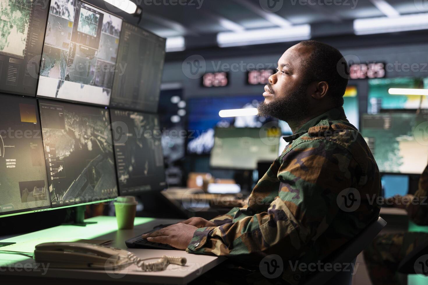 Air defense command operator using radar systems to detect incoming ballistic missiles. Army soldier in base of operations scanning rockets approaching borders, deploying shields photo
