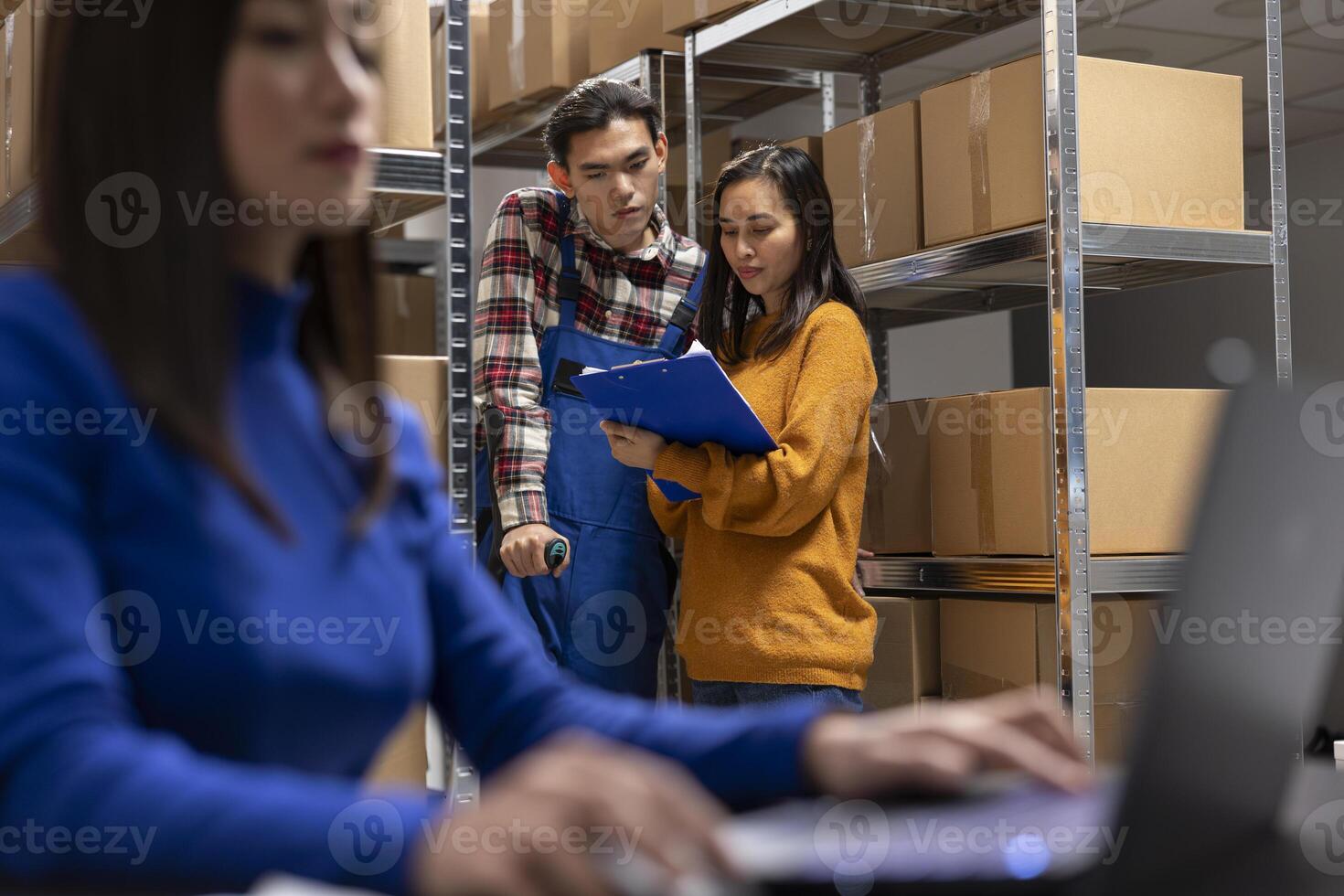 Asian staff member with reduced mobility on crutches prepares parcels in a storage room depot. Team managing in house logistics, order processing and small scale retail delivery. photo