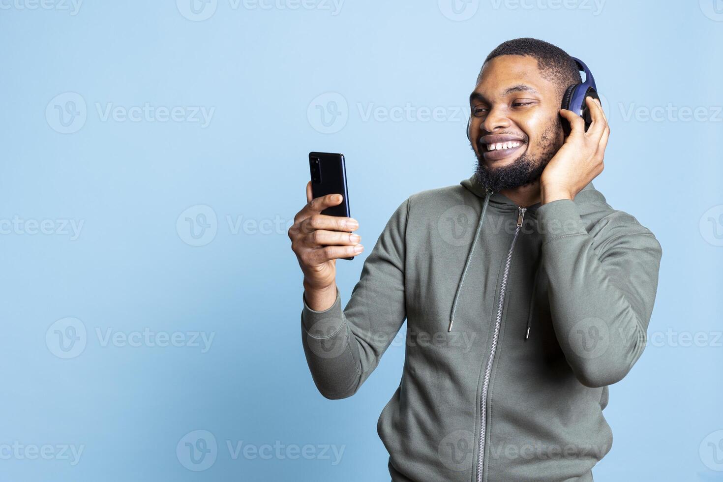Man listening to music on smartphone photo