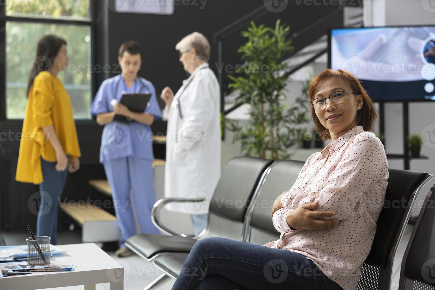 Woman in clinic waiting area photo