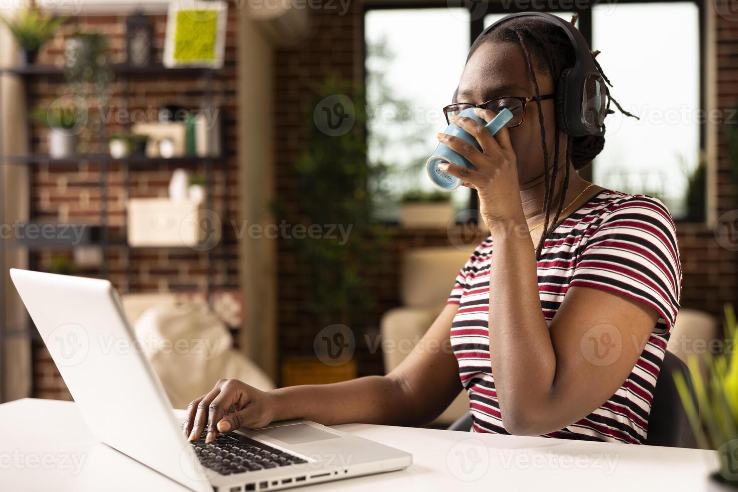 Woman working from home with coffee photo