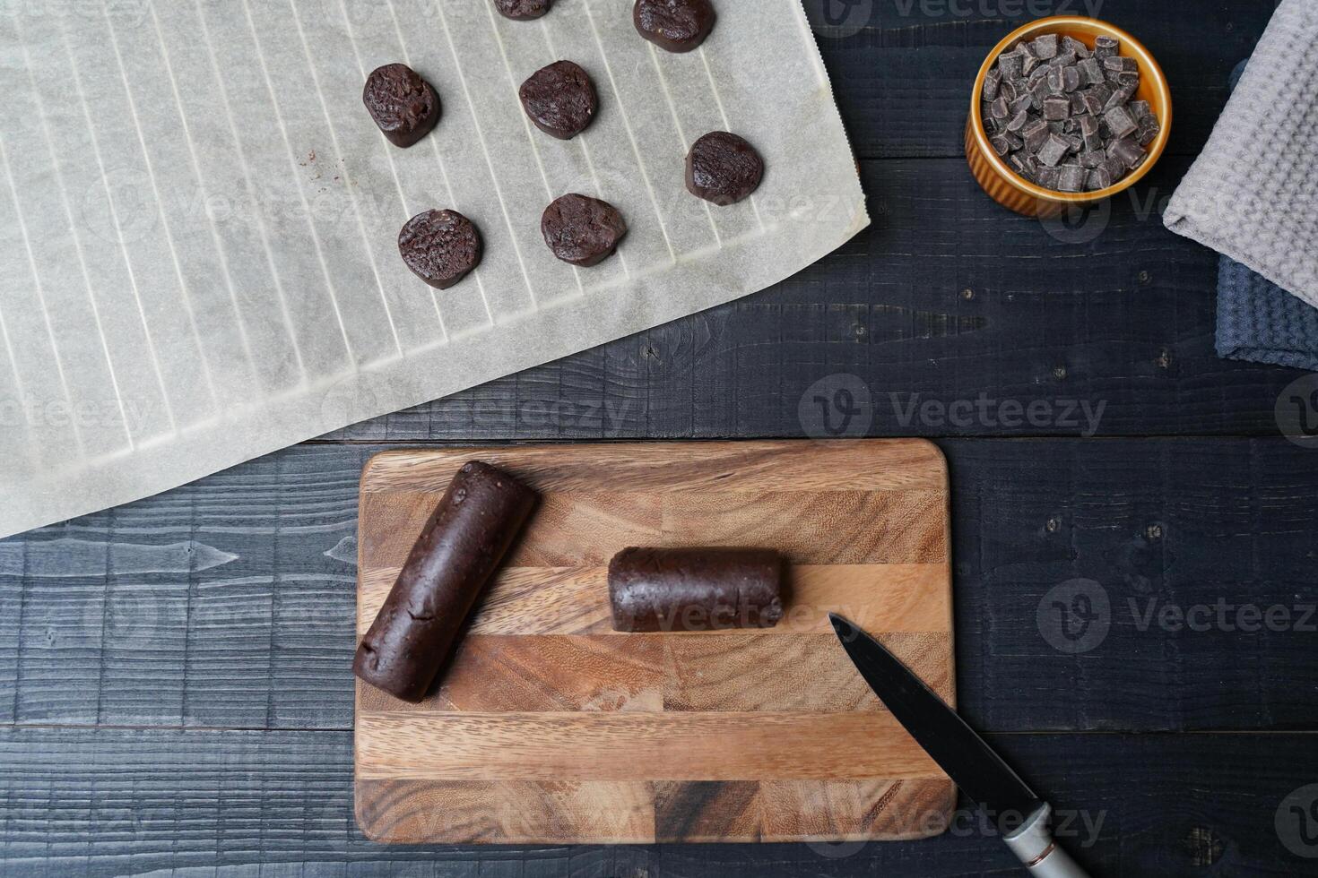 Top view of cookie dough bar with chocolate chips and baking tools photo