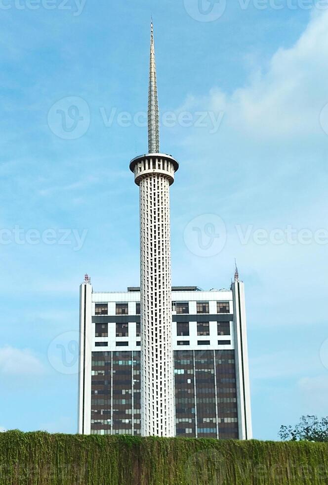 Istiqlal Mosque s Tall Minaret Against Blue Sky photo